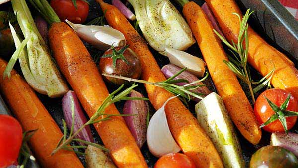 assorted fresh vegetables. Carrots, Tomatoes, Onions, Celery